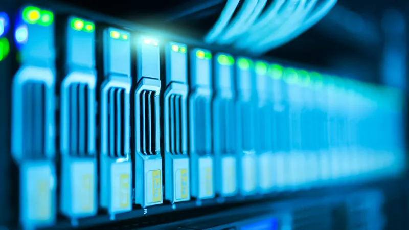 Close-up of a managed server rack with patch cables and indicator lights, illustrating the layered defense-in-depth security architecture behind a modern web application