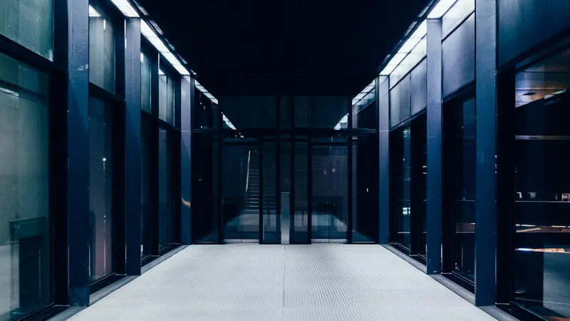 Modern data center hallway representing the proprietary infrastructure behind serverless hosting platforms